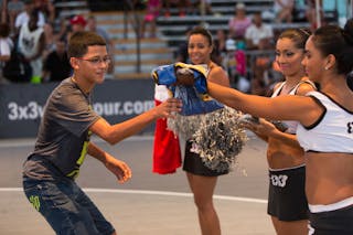 Cheerleaders give gift to fans at the San Juan Masters 10-11 August 2013 FIBA 3x3 World Tour, San Juan, Puerto Rico
